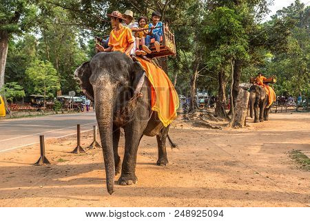 Angkor Wat, Cambodia - March 15, 2018: Tourists Ride An Elephant At The Area Of Angkor Wat, Near Sie