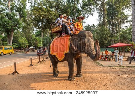 Angkor Wat, Cambodia - March 15, 2018: Tourists Ride An Elephant At The Area Of Angkor Wat, Near Sie