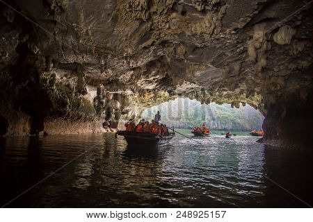 Halong, Vietnam - June 17, 2018: Tourists Exploring Cave In Halon Bay, Vietnam In A Summer Day