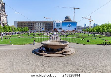 Berlin / Germany - April 29, 2018: Panoramic Image Of Tourists Relaxing At The Lustgarten In The Cen