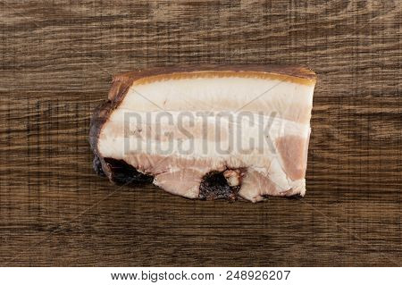 One Piece Of English Bacon Flatlay On Brown Wood