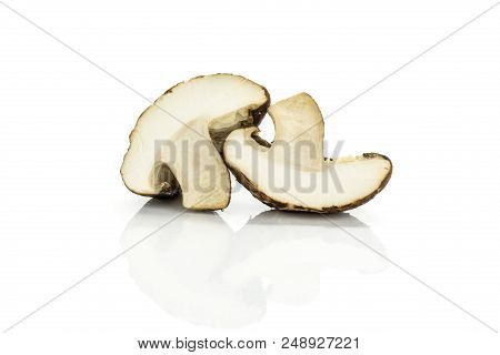 Group Of Two Halves Of Fresh Raw Brown Shiitake Mushroom Isolated On White