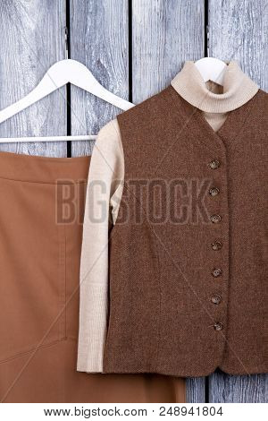 Warm Brown Garment. Flat Lay, Top View. Brown Long Skirt And Jacket.