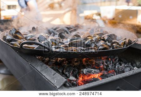 Fresh Mussels At Grill Pan. Seafood Barbecue Outdoors. Picnic Healthy Food, Mussels In Shells. Plent