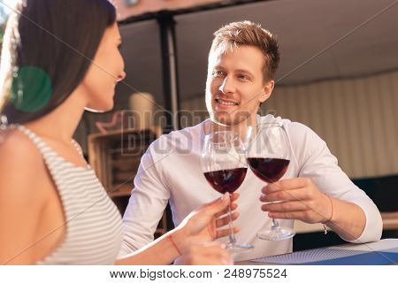 Giving Compliments. Blue-eyed Handsome Man Giving Compliments To Her Woman