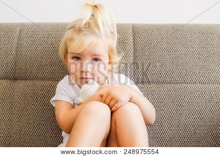 Close Up Portrait Of Emotional Adorable Toddler Girl Hugging Her Toy, Teddy Bear And Sitting On The 