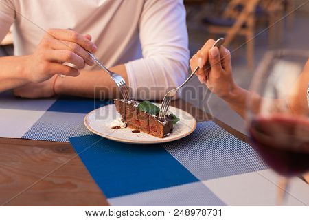 Chocolate Cake. Young Modern Couple Eating Delicious Chocolate Cake Together During Their Romantic D