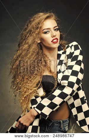 Beauty Fashion Model Portrait. Portrait Of Attractive Radiant Looking Blond Young Woman With Fly-awa