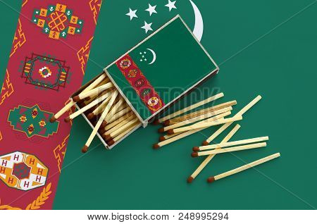 Turkmenistan Flag  Is Shown On An Open Matchbox, From Which Several Matches Fall And Lies On A Large