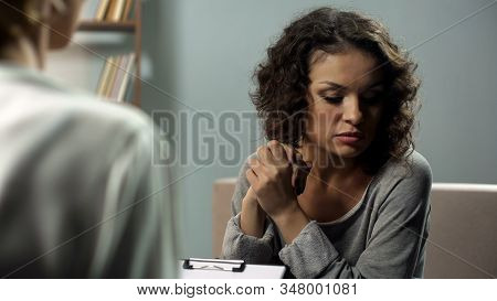 Sad Female Talking To Her Psychotherapist At Personal Meeting, Feeling Anxious