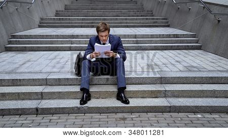 Lawyer Analyzing Documents Angry About Insufficient Information, False Data