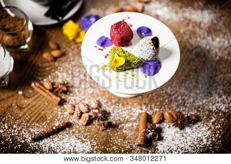 Vegan Truffles Dessert Served On A Plate In Restaurant