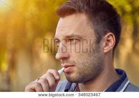 Electronic Cigarettes, Cigarette Technology. Tobacco Iqos System. Close-up Of A Man Smoking An Elect