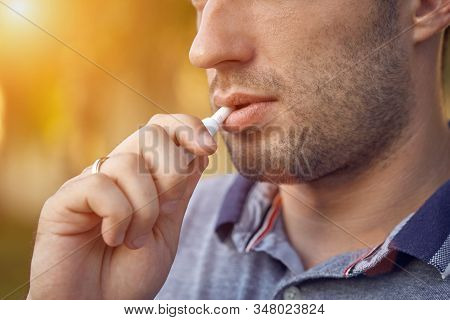 Electronic Cigarettes, Cigarette Technology. Tobacco Iqos System. Close-up Of A Man Smoking An Elect