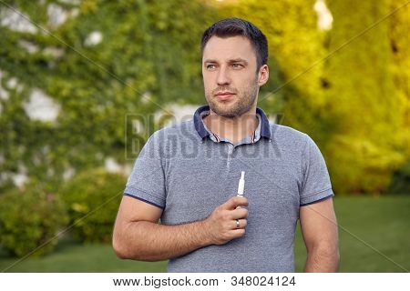 Electronic Cigarettes, Cigarette Technology. Tobacco Iqos System. Close-up Of A Man Smoking An Elect