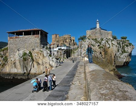 People Walking At The Port In Castro Urdiales, Spain