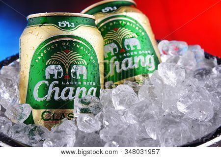 Two Cans Of Chang Beer In Bucket With Crushed Ice