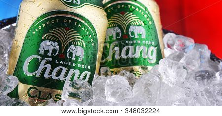 Two Cans Of Chang Beer In Bucket With Crushed Ice