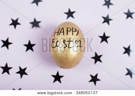 Happy Easter Concept. Top View Of Easter Egg Colored With Golden Paint On Fastive Background With St