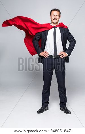 Young Handsome Businessman In Suit And Hero Cout Isolated On White Background