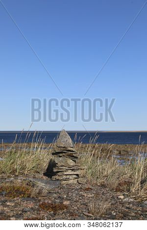 Single Inukshuk Or Inuksuk Along The Arctic Coast Near Arviat, Nunavut