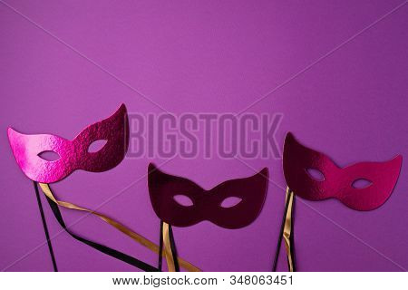Festive, Colorful Mardi Gras Or Carnivale Mask And Accessories Over Purple Background. Party Invitat