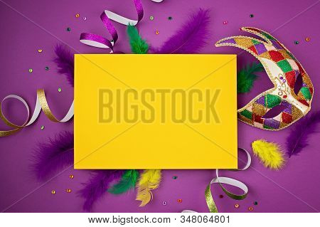 Festive, Colorful Mardi Gras Or Carnivale Mask And Accessories Over Purple Background. Party Invitat