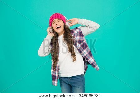 Singing With Mp3 Player. Small Child Long Hair Enjoy Stereo. Happy Childhood. Happy Girl Turquoise B