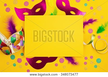 Festive, Colorful Mardi Gras Or Carnivale Mask And Accessories Over Yellow Background. Party Invitat