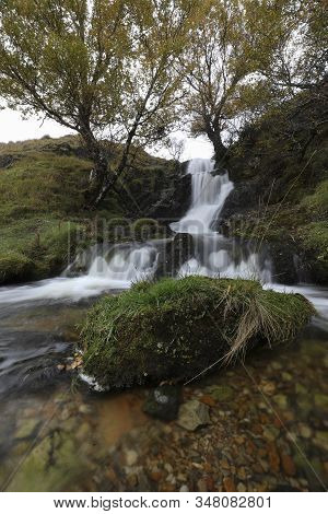 Rural Waterfall Near Ardvreck Castle In The Northwestern Highlands Of Scotland