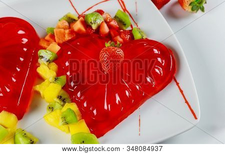 Strawberry Gelatin Decorated With Fresh Strawberry, Kiwi And Pineapple. Dessert For Valentines Day.
