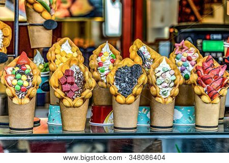 Chinese Hong Kong Waffles With Ice Cream, Jam And Fruit. Delicious Bubble Wafers In The Old Town Of 