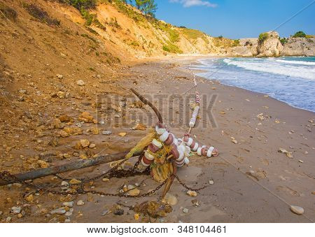 An old ship's anchor on the beach on the Black Sea coast at Kilimli Bay, near Agva, Sile, in north west Turkey