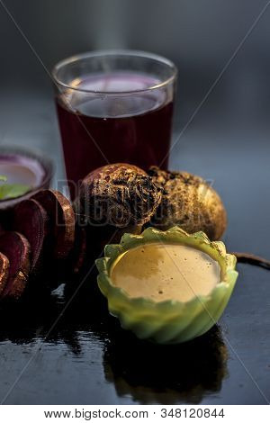 Close Up Of Fresh Beetroot Juice In A Glass Along With Some Multani Mitti Or Fuller's Earth In Glass