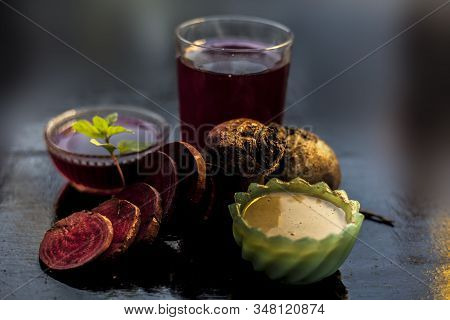 Close Up Of Fresh Beetroot Juice In A Glass Along With Some Multani Mitti Or Fuller's Earth In Glass