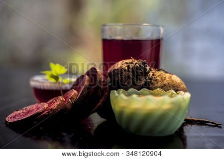 Close Up Of Fresh Beetroot Juice In A Glass Along With Some Multani Mitti Or Fuller's Earth In Glass