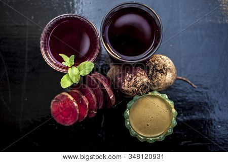Close Up Of Fresh Beetroot Juice In A Glass Along With Some Multani Mitti Or Fuller's Earth In Glass