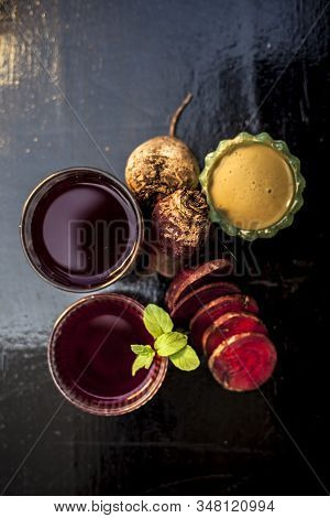 Close Up Of Fresh Beetroot Juice In A Glass Along With Some Multani Mitti Or Fuller's Earth In Glass