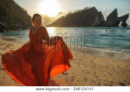 Woman at Atuh beach at Nusa Penida Island, Bali, Indonesia