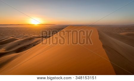Orange Skies During Sunset At The Sahara Desert, Erg Chebbi, Merzouga, Morocco