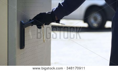 Bank Employee Opening Atm Safe With Keys To Load Storage With Cash, Security