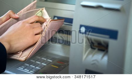 Female Hands Putting Dollars In Wallet, Cash Withdrawn From Atm, Travelling
