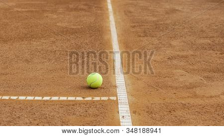 Tennis Ball Lying Near Baseline On Clay Court, Healthy Lifestyle, Close Up