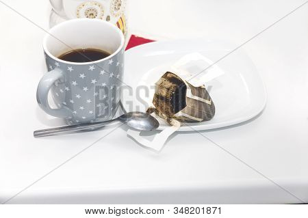 Drip Coffee Used Bag And A Muf With Aromatic Coffee On A Table Top
