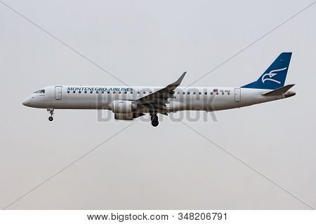 Frankfurt / Germany - December 7, 2012: Montenegro Airlines Embraer 190 4o-aoa Passenger Plane Landi