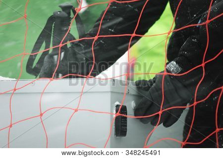 Skier Using Ski Pass To Get On The Ski Lift Close Up.
