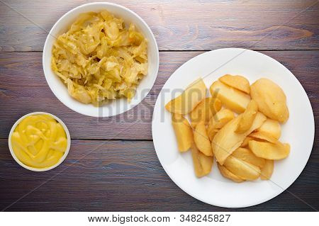 Fry Potatoes With Vegetable Salad On A Pueple Wooden Background. Fry Potatoes On A White Plate