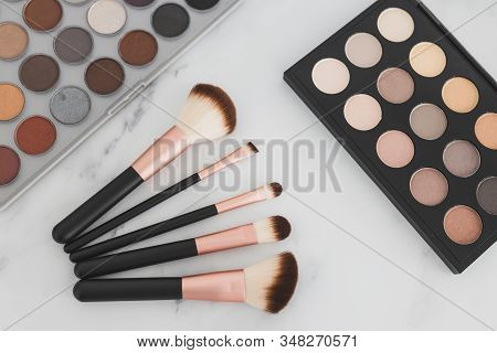 Beauty Industry And Make-up Products, Eyeshadow Palettes With Nudes And Bronzy Tones With Brushes