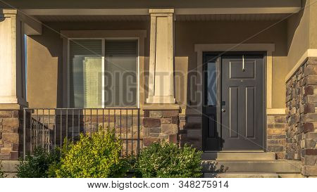 Panorama Frame Stairs Leading To Porch And Front Door With Sidelight At The Entrance Of Home