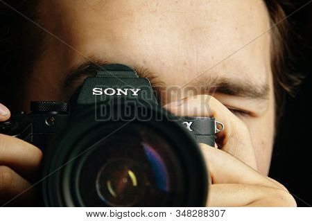 Bishkek, Kyrgyzstan - December 15, 2019: Man Holds A Sony A7 Camera In His Hands And Takes Images In